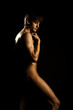 studio portrait of a young muscular naked man