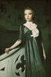 Photo: woman in elegant dress posing on stairs woman in elegant dress posing on stairs