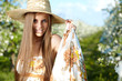Woman wearing blue dress in amazing fruits garden