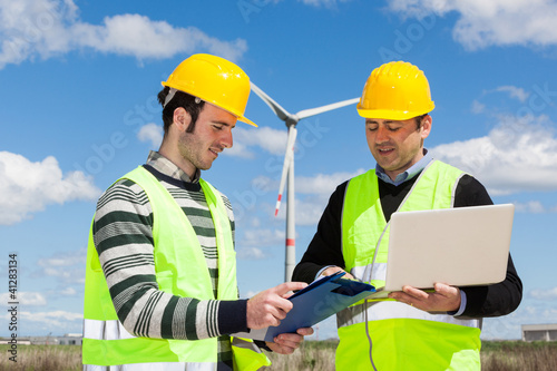 Photo: Two Engineers in a Wind Turbine Power Station Two Engineers in a Wind Turbine Power Station