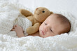 Baby mit Teddy