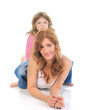 cheerful girl hugs her young mother. cheerful girl hugs her young mother.