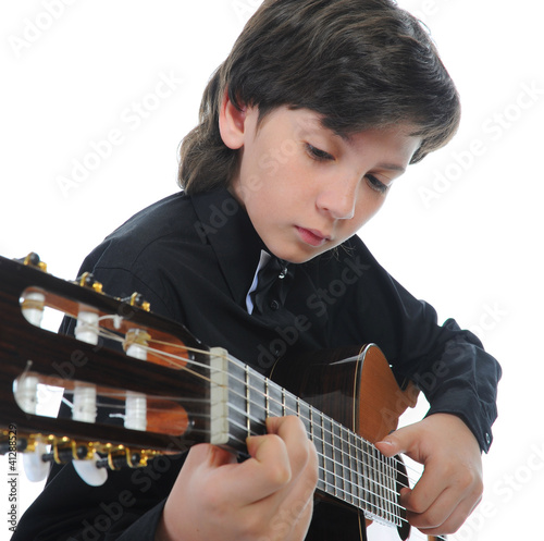Photo: Little boy musician playing guitar Little boy musician playing guitar