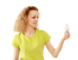 Pensive young woman looking at energy-saving bulb