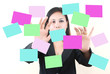 Business lady pushing note paper on the whiteboard. Business lady pushing note paper on the whiteboard.
