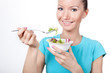 Woman eating vegetarian salad
