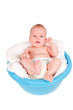 Cute baby portrait in washbasin isolated on white background