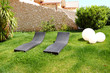 Sunbeds on lawn by luxury villa, Pieria, Greece