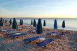 Sunbeds on a beach during sunrise, Halkidiki, Greece