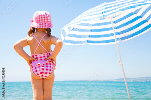Photo: little girl on sea beach little girl on sea beach