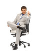 canvas print picture - young businessman sitting in chair