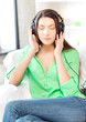 happy teenage girl in big headphones