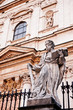 Statue of a saint in front of the Saints Peter and Paul Church i