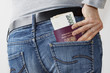 Woman taking Czech Passport and money out of jeans pocket