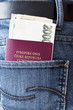 Photo: Czech passport with money in the back pocket of woman's jeans.. Czech passport with money in the back pocket of woman's jeans..