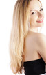 Beautiful girl with long blond hair, smiling, isolated on white