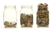 Three glass jars holding coins Three glass jars holding coins
