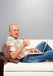 elderly smiley man with notebook
