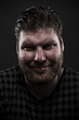 Pensive smiling man