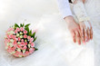 Hands of the groom and the bride with wedding rings