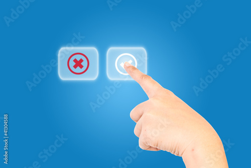 Photo: Hand pushing correct button. Hand pushing correct button.