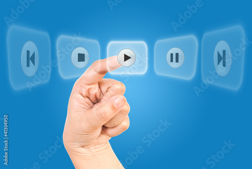 Photo: Hand pushing Play Icon. Hand pushing Play Icon.