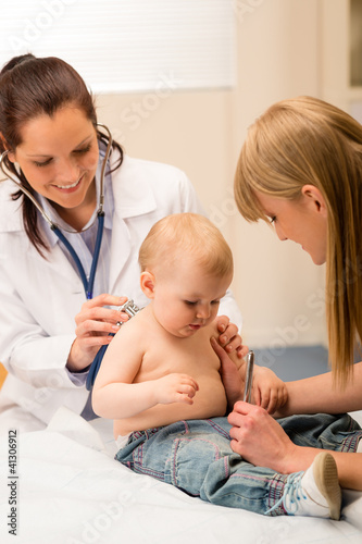 Photo: Pediatrician check-up baby girl with stethoscope Pediatrician check-up baby girl with stethoscope