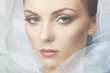 Fashion photo of beautiful women under blue veil