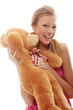 Charming blondeembraces teddy bear