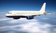 Big jet plane flying above clouds