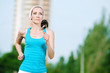 Beautiful woman running in green park Beautiful woman running in green park
