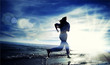 Sporty woman running in sea coast Sporty woman running in sea coast