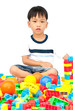 Little boy playing with toy on white background