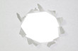 Broken a hole in a sheet of paper