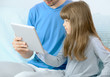 Father and daughter looking at digital tablet Father and daughter looking at digital tablet