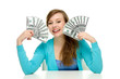 Young woman holding dollar bills
