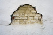 old brick wall with a gap and cracks
