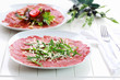Carpaccio with arugula and cheese