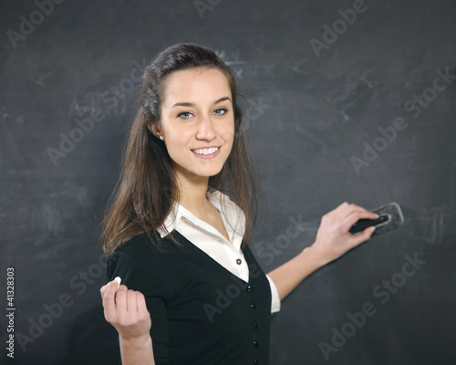 Photo: teacher Erasing The Blackboard teacher Erasing The Blackboard