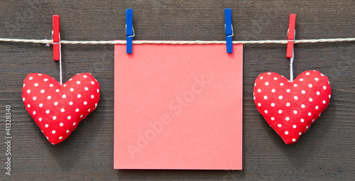Photo: Zwei rote Herzen mit Zettel - Love Concept Zwei rote Herzen mit Zettel - Love Concept
