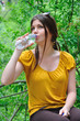 handsome woman drinking water in nature handsome woman drinking water in nature