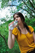 woman drinking water in nature woman drinking water in nature
