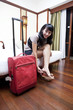 Asian woman in a hotel room