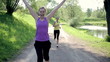 Video: Two young women running in the park, slow motion Two young women running in the park, slow motion