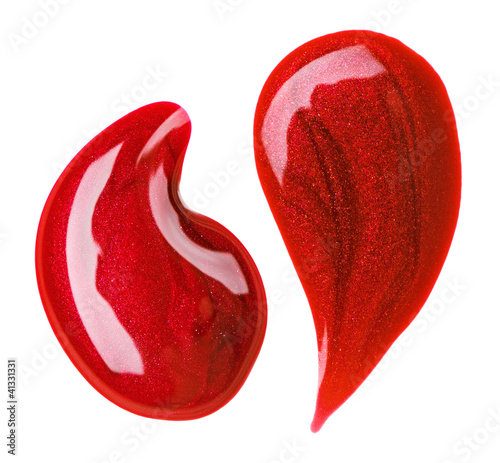 Photo: Red nail polish (enamel) drops sample, isolated on white Red nail polish (enamel) drops sample, isolated on white
