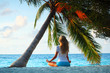 yoga woman under palm