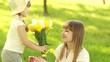 Daughter gives mother flowers