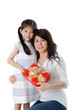 Little Asian girl giving gift for mother