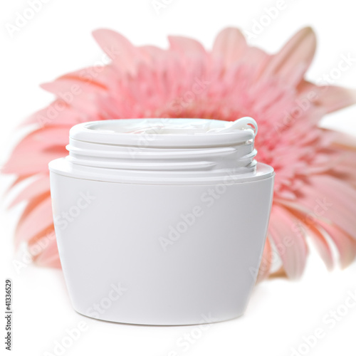 Photo: Moisturizing face cream with a pink gerbera Moisturizing face cream with a pink gerbera