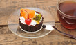 delicious cake with fruit and a cup of tea delicious cake with fruit and a cup of tea